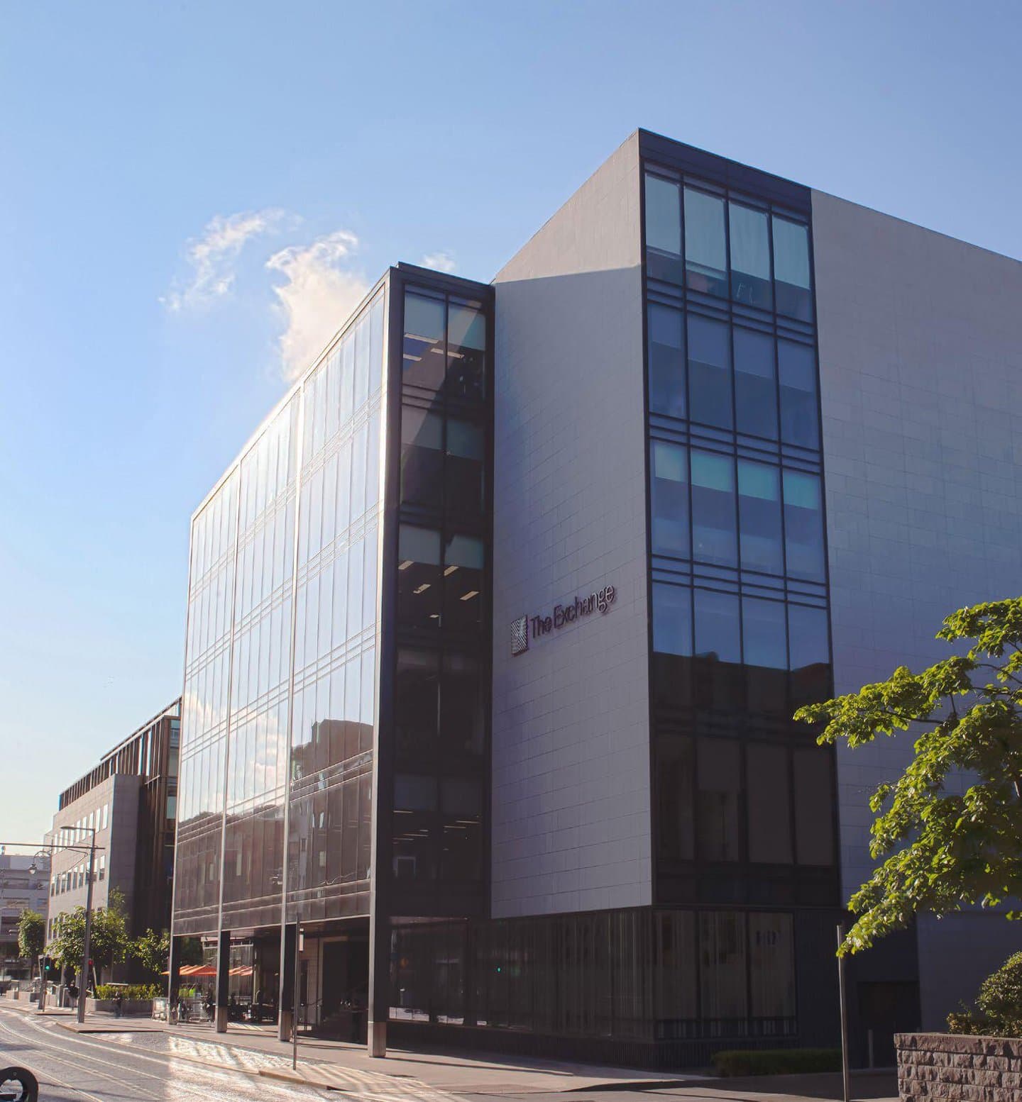 View of the building with the name 'The Exchange' on the outside.